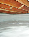 a moisture barrier installed on the walls and floors of a crawl space in Peabody