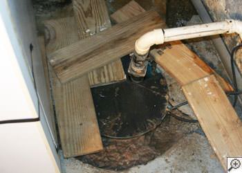 An ugly, clogged sump pump system in Framingham, Massachusetts