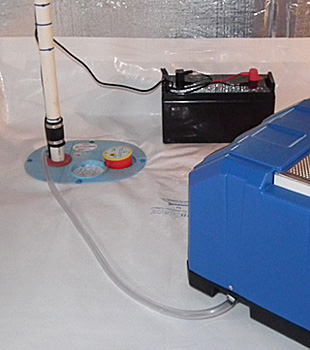 Closeup of a crawl space sump pump installed in Waltham