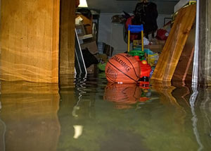 A flooded basement bedroom in Dracut
