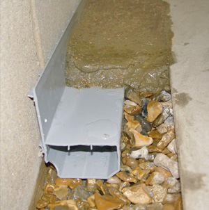 french drain or drain tile installed along the inside perimeter of the foundation for waterproofing
