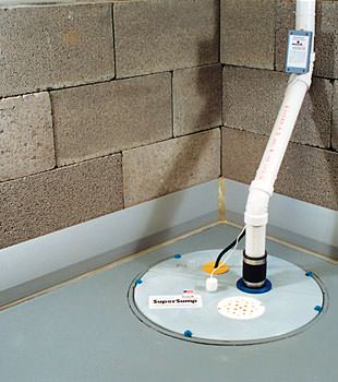 A baseboard basement drain pipe system installed in Medford