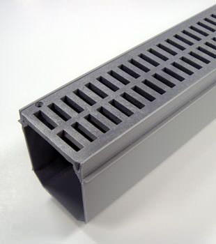 A closeup of our grated basement drainage pipe system, installed in Beverly