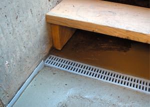 a hatchway entrance in Woburn that has been protected from flooding by our TrenchDrain basement drainage system.