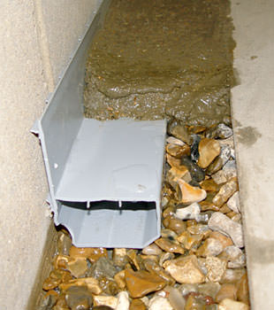 A basement drain system installed in a Framingham home