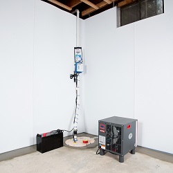 a complete basement waterproofing system installed in a Lowell home