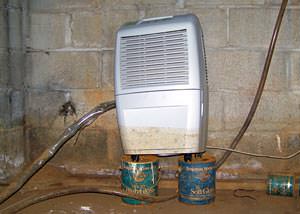 dehumidifier shows signs of being half-submerged in water