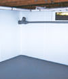 Cambridge, MA wet basement wall covering that tucks into a perimeter drainage system