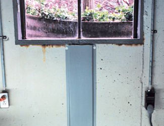Repaired waterproofed basement window leak in Somerville