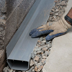 installing a drain tile system in a Watertown home