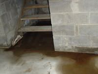 Water Pouring into a Medford Basement through Hatchway Doors